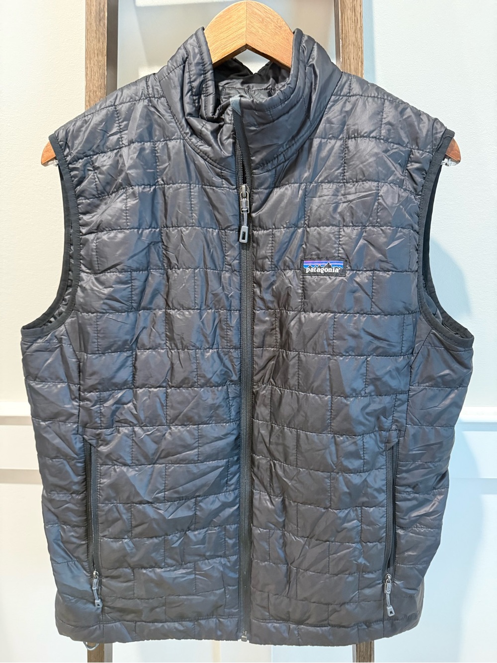 Patagonia Men's Nano Puff Vest in black “VetEvolve” embroidered on back medium
